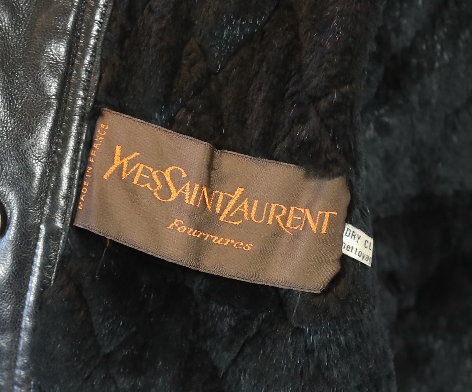 A Yves Saint Laurent Fourrures gentlemen's black quilted leather bomber jacket with fur collar and lining, approx size 42